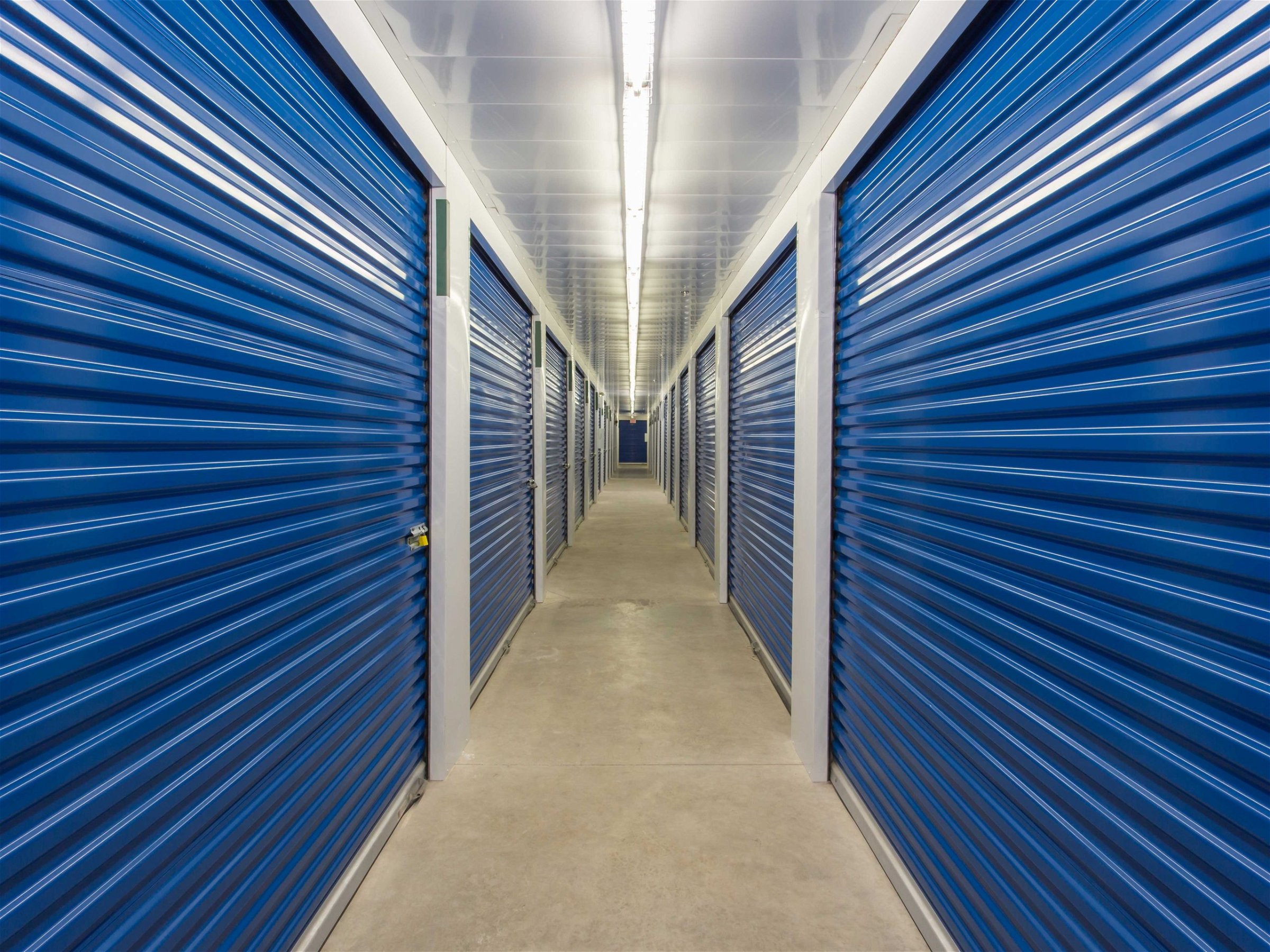 bright hallway with storage unit doors